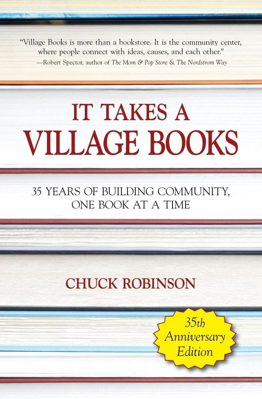 Book cover of It Takes a Village Books: 35 Years of Building Community, 1 Book at a Time by Robinson, Chuck E.